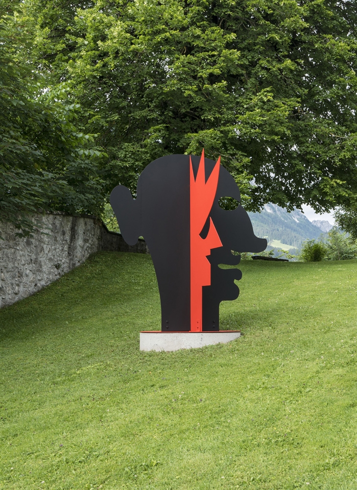 Steel plate sculpture of faces