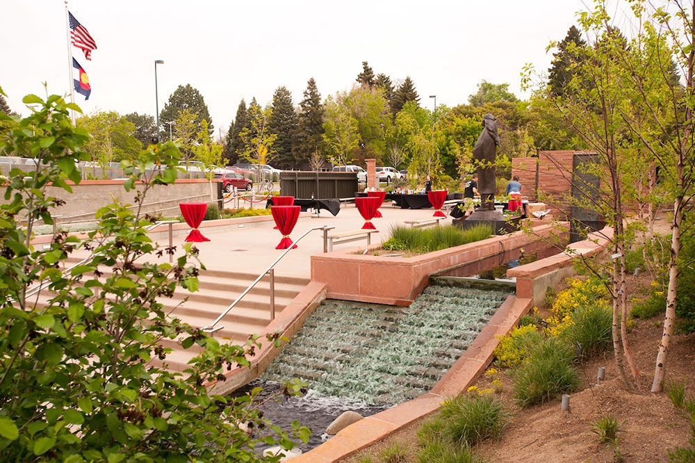 Small tables lining the walkway of the welcome garden