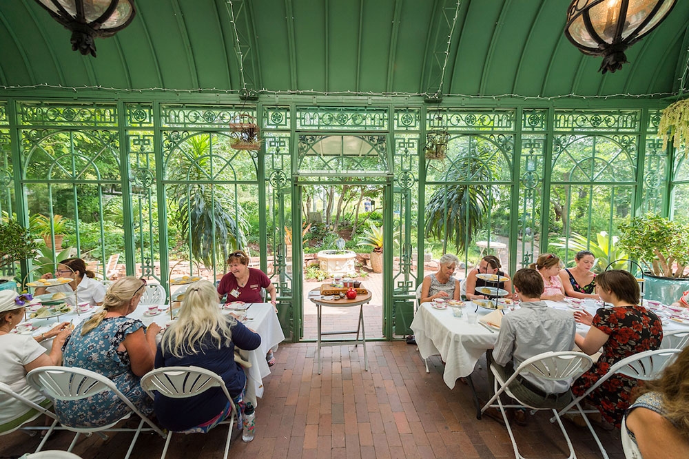 Event attendees sitting inside solarium