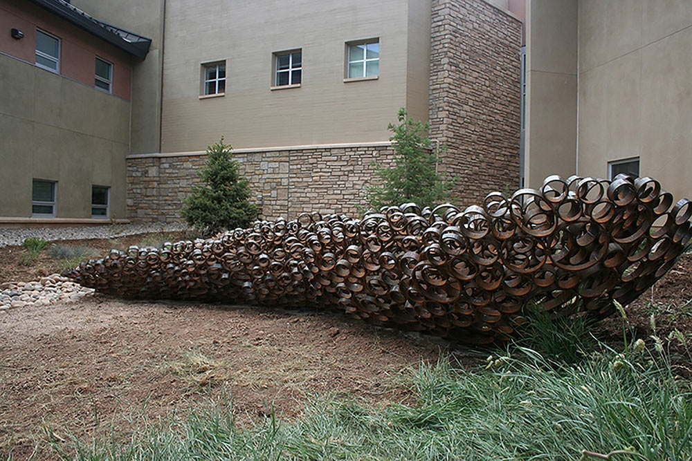 Paula Castillo, "Fallen Petals," sheared, reformed and welded Corten steel, 2014.