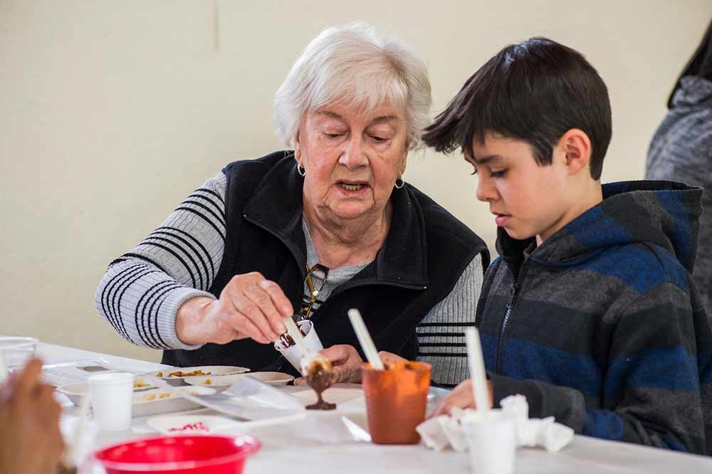 Adult and child doing a craft together