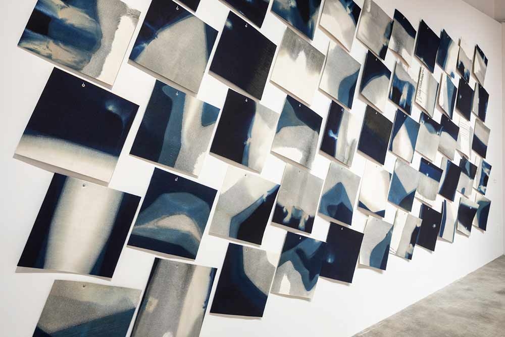 Rowland Ricketts, “Drawings” (detail), indigo-dyed wool felt, 2016-2019. Installation at the Museum of Craft and Design. Photo: Henrik Kam. 