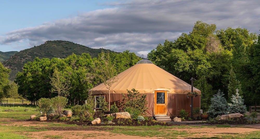 Yurt with mountains in background