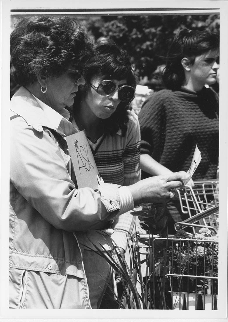 black and white photo of two women at plant sale