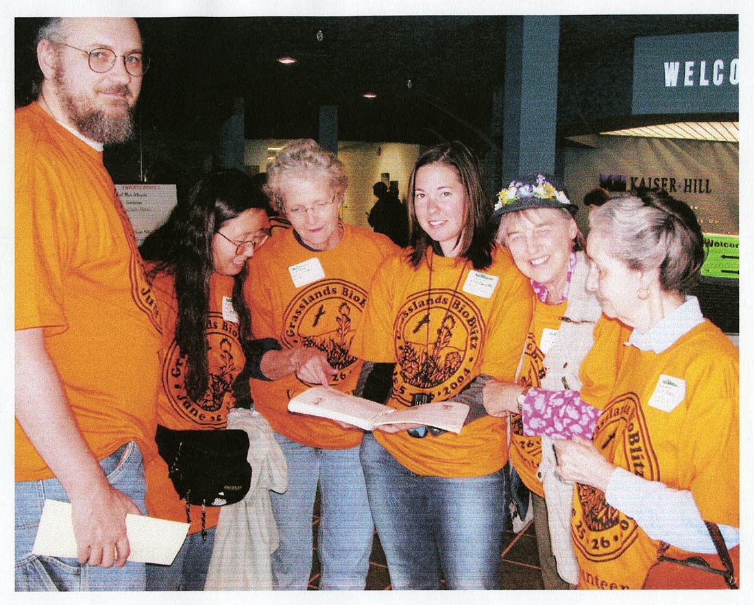 Group of volunteers in orange shirts