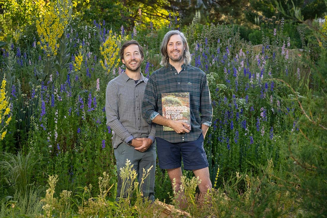 The authors with their book