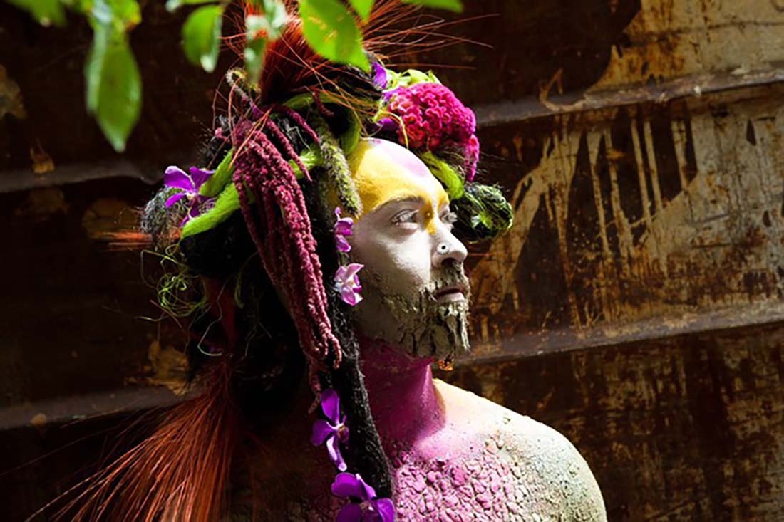 Man with elaborate floral headdress