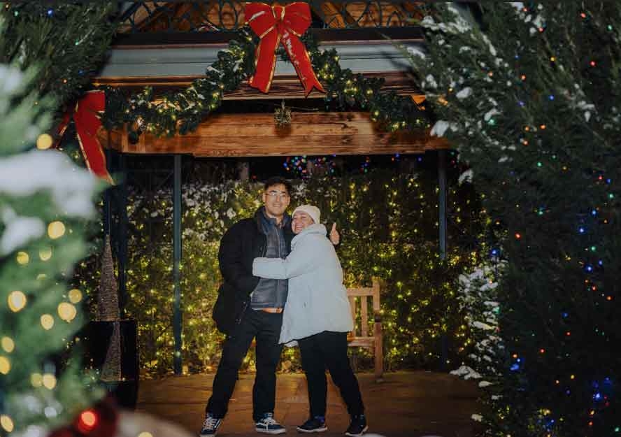 Two people getting engaged in the gazebo in the enchanting Victorian Secret Garden